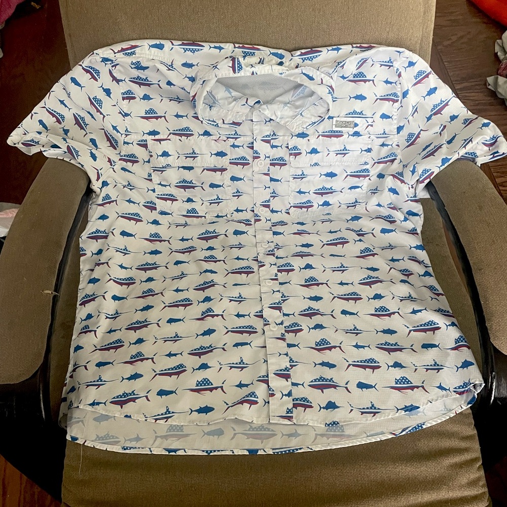 This is a ocean coast XXL shirt that has red white and blue on it